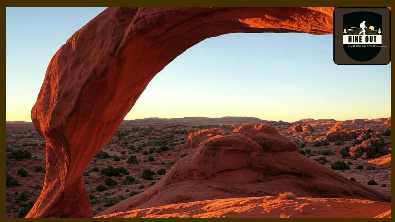 "Red rock arch at Hidden Valley Loop Hike Arizona during sunrise, showcasing golden light for stunning photos on this quiet trail."