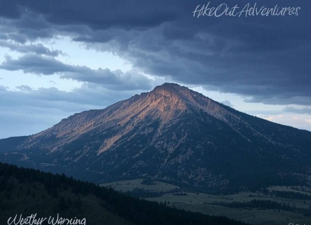 Dangerous afternoon thunderstorms gathering over Humphreys Peak summit in summer